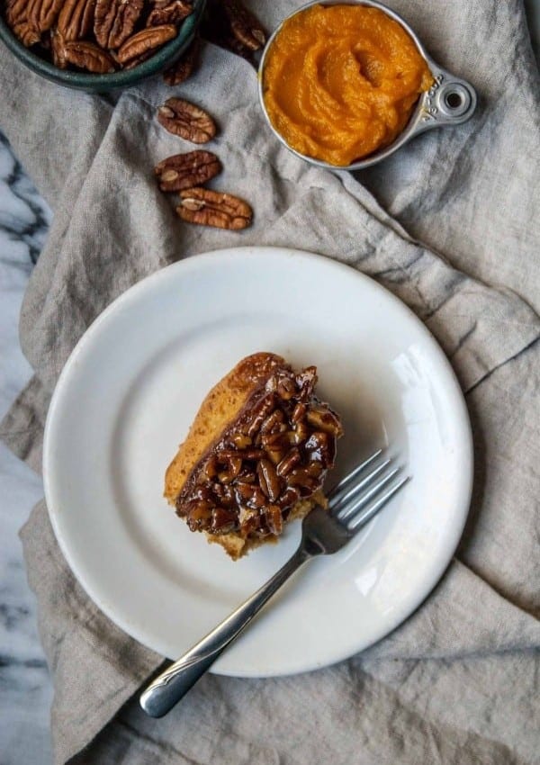 Fluffy and sweet vegan sticky buns flavored with pumpkin and spices, topped with a vanilla bean pecan glaze!