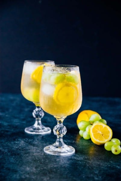 Sweet Lemon Grape Sangria- An easy and breezy spring cocktail, made with sweet white wine and fresh grapes and lemon slices!