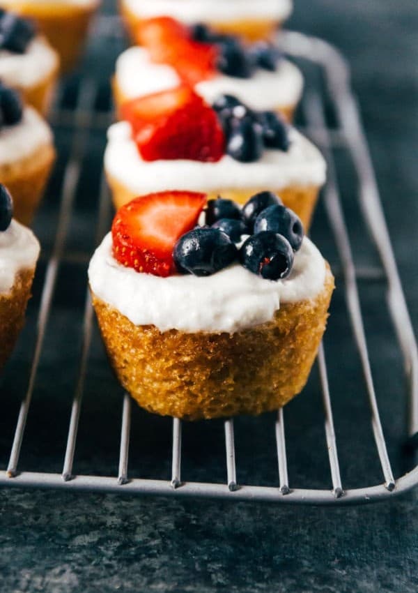 Vegan lemon cakes with a sweet coconut whipped topping and the summer's prettiest berries!
