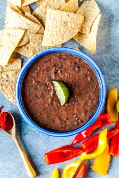 A perfectly spicy vegan black bean dip, great for your next party or potluck! Chock full of black, beans, garlic, and a hefty dose of your favorite salsa.