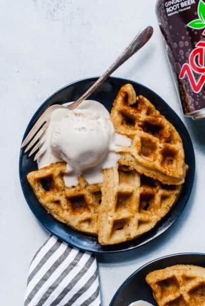 Waffle on plate with melting ice cream scoop and zevia can